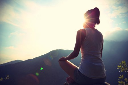depositphotos_76223467-stock-photo-yoga-woman-meditating-on-mountain.jpg